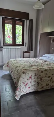 Letto o letti in una camera di Da Lisa