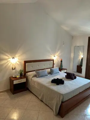Letto o letti in una camera di Angela House