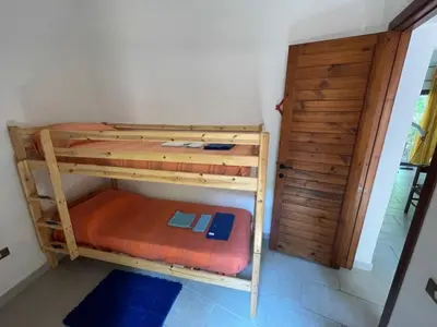 Letto o letti in una camera di Casa Bouganville Pinus Village