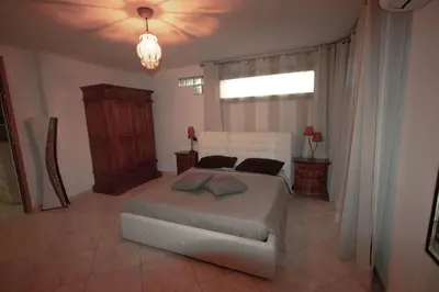 Letto o letti in una camera di Villa Gallo - Seminterrato luminoso