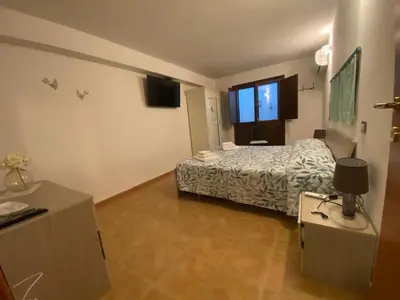 Letto o letti in una camera di Villa Lotty a 5 minuti a piedi dal mare