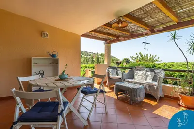 Balcone o terrazza di La Bouganville - House with garden and sea view