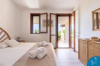 Letto o letti in una camera di La Bouganville - House with garden and sea view