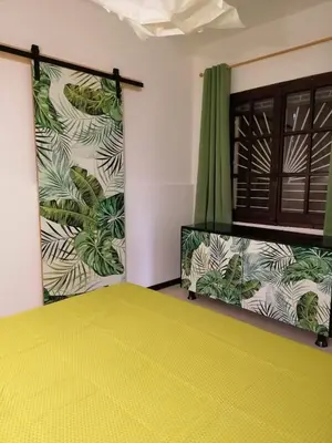 Letto o letti in una camera di Jungle Room