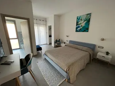 Letto o letti in una camera di Baboe Affittacamere IUN F1037