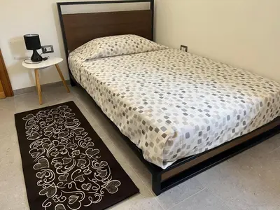 Letto o letti in una camera di Baboe Affittacamere IUN F1037
