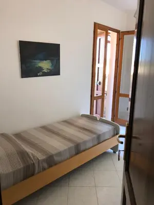 Letto o letti in una camera di La Villa dell Artista con vista mare e dune - IUN Q7440
