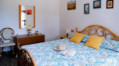 Letto o letti in una camera di Villa Assunta