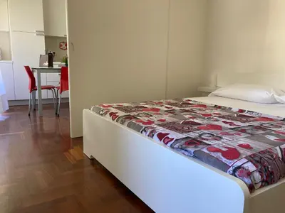 Letto o letti in una camera di ROSSINI Apartment Parking