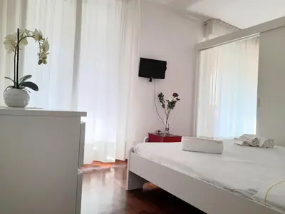 Letto o letti in una camera di ROSSINI Apartment Parking