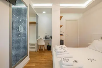 Letto o letti in una camera di Helios Guest House