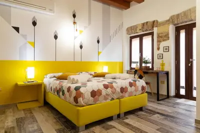 Letto o letti in una camera di Trigu & Mangoni