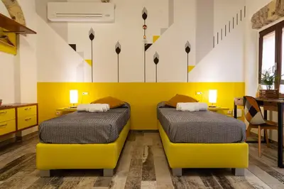 Letto o letti in una camera di Trigu & Mangoni
