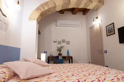 Letto o letti in una camera di Trigu & Mangoni