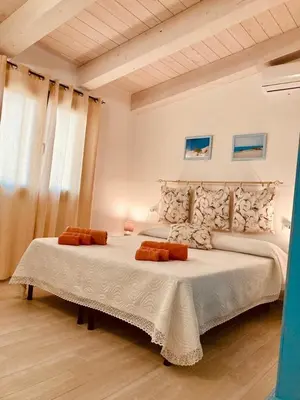 Letto o letti in una camera di IL TRAMONTO