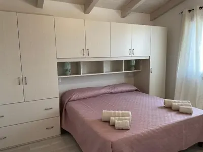 Letto o letti in una camera di IL TRAMONTO