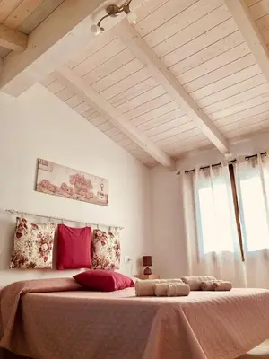 Letto o letti in una camera di IL TRAMONTO