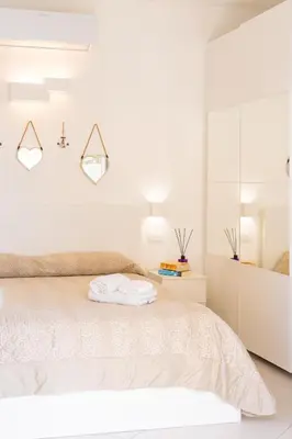 Letto o letti in una camera di Residenza del Barone Luxury House - Pula, Sardegna