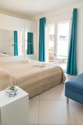 Letto o letti in una camera di Residenza del Barone Luxury House - Pula, Sardegna