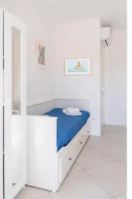 Letto o letti in una camera di Residenza del Barone Luxury House - Pula, Sardegna