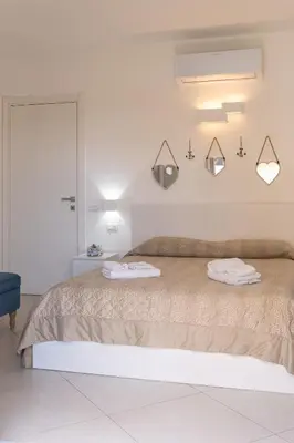 Letto o letti in una camera di Residenza del Barone Luxury House - Pula, Sardegna
