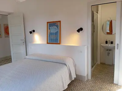Letto o letti in una camera di B&B San Gregorio SINNAI