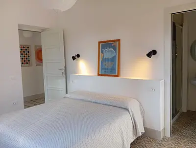 Letto o letti in una camera di B&B San Gregorio SINNAI