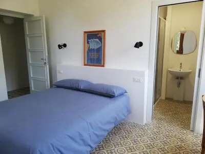 Letto o letti in una camera di B&B San Gregorio SINNAI