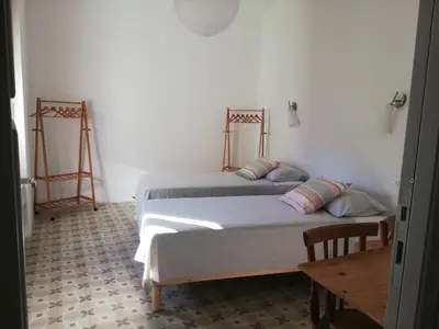 Letto o letti in una camera di B&B San Gregorio SINNAI
