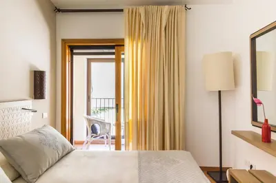 Letto o letti in una camera di Hotel Aquadulci