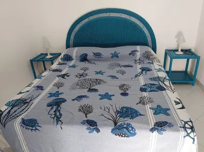 Letto o letti in una camera di Costa Rei - Casa vacanza a 200 mt dal mare