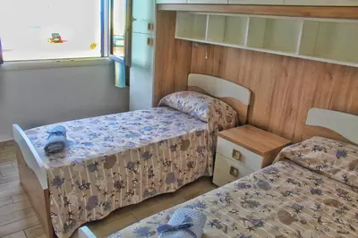 Letto o letti in una camera di tommy house