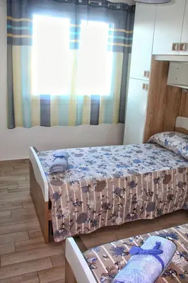 Letto o letti in una camera di tommy house