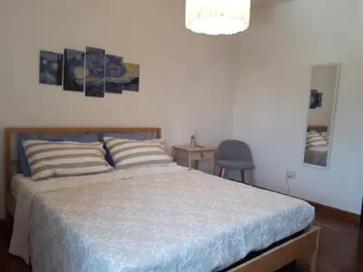Letto o letti in una camera di Villa degli Ulivi