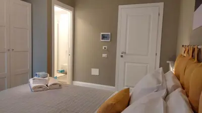 Letto o letti in una camera di MomHouse - Appartamento - cagliari