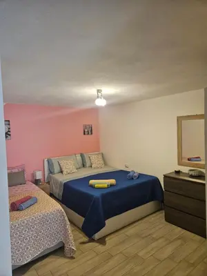 Letto o letti in una camera di Paraiso S