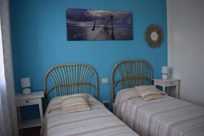 Letto o letti in una camera di Casa rosa dei venti