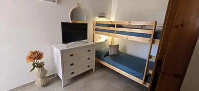 Letto o letti in una camera di Simius Perla Marina