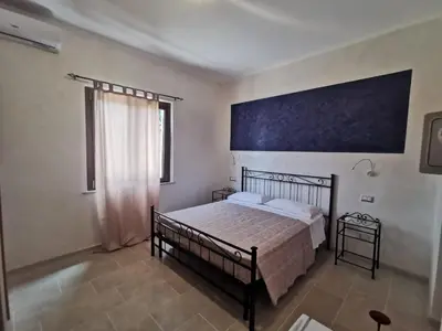Letto o letti in una camera di Villa Bianca