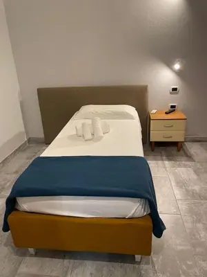 Letto o letti in una camera di Casa Camere Pistis