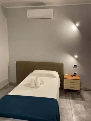 Letto o letti in una camera di Casa Camere Pistis