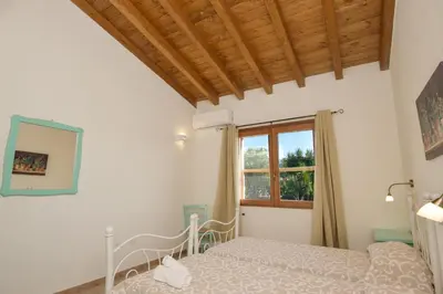 Letto o letti in una camera di Villetta Saeprus