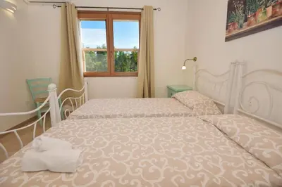 Letto o letti in una camera di Villetta Saeprus