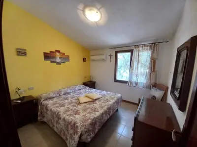 Letto o letti in una camera di Casa Aldebaran