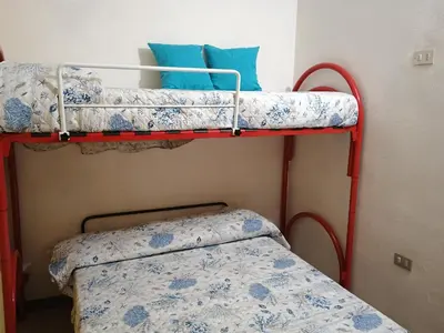 Letto o letti in una camera di Casa Aldebaran