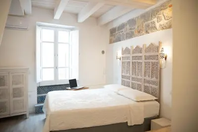 Letto o letti in una camera di B&B Terra - Stanza Viaggio