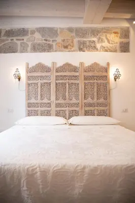 Letto o letti in una camera di B&B Terra - Stanza Viaggio