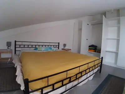 Letto o letti in una camera di Appartamento per vacanze e brevi periodi IUN Q2474