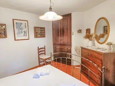Letto o letti in una camera di Villa Alice e Silvia - Chia