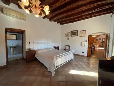 Letto o letti in una camera di Villa Mariuccia